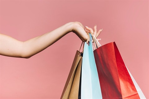 hand-with-colorful-shopping-bags_23-2147962257.jpg